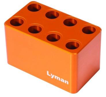 Orange metal block with eight circular holes