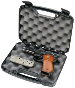 Handgun with magazine in foam-lined case.