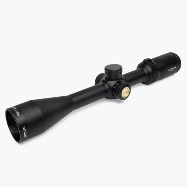 Black rifle scope with adjustment knobs.