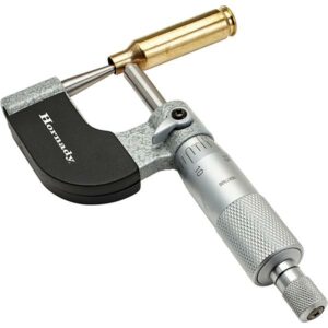 Precision micrometer measuring tool with brass case.