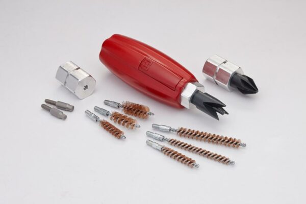 Red cable stripping tool with brushes and attachments.