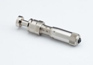 Stainless steel torque wrench with calibration markings.