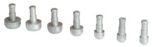 Seven metal dowel pins of different sizes.