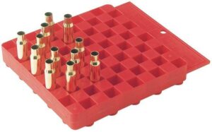 Red ammo reloading tray with brass casings.