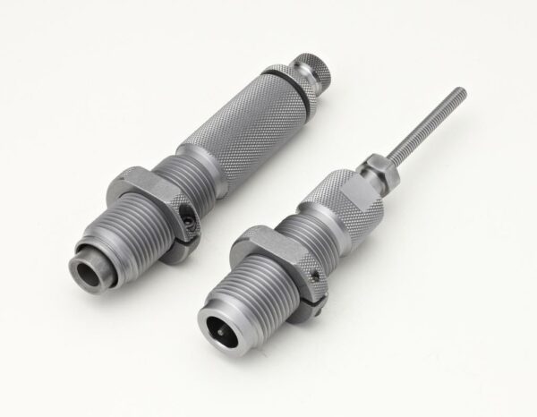 Metallic threading tools on white background.