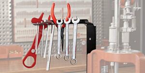 Assorted tools hanging on a workshop rack
