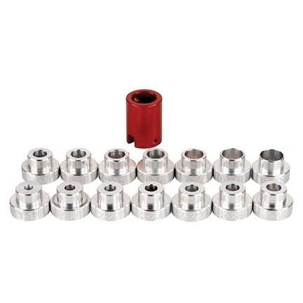 Set of metal bushings, one red, others silver.