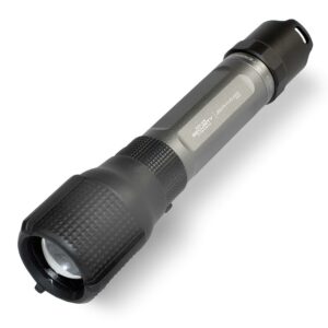 Black tactical flashlight with textured grip