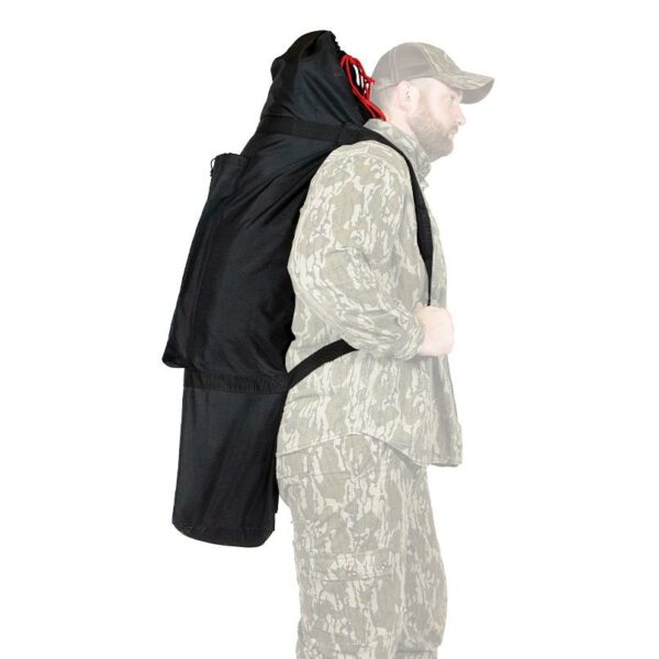 Person carrying large black backpack with bow.