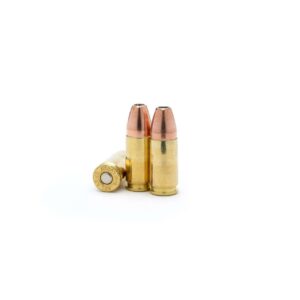Three brass bullets standing on white background.
