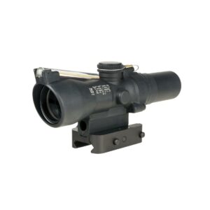 Black rifle scope with lens and adjustment knobs.