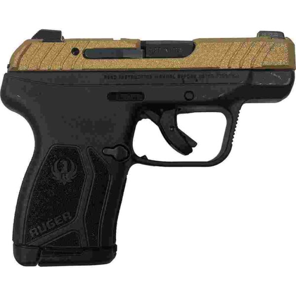 Compact black and gold handgun, side view.