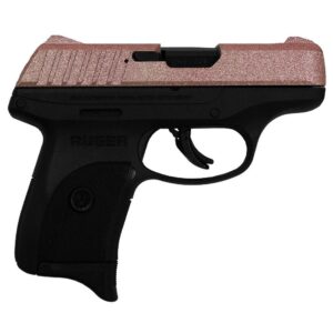 Pink Ruger handgun on white background.