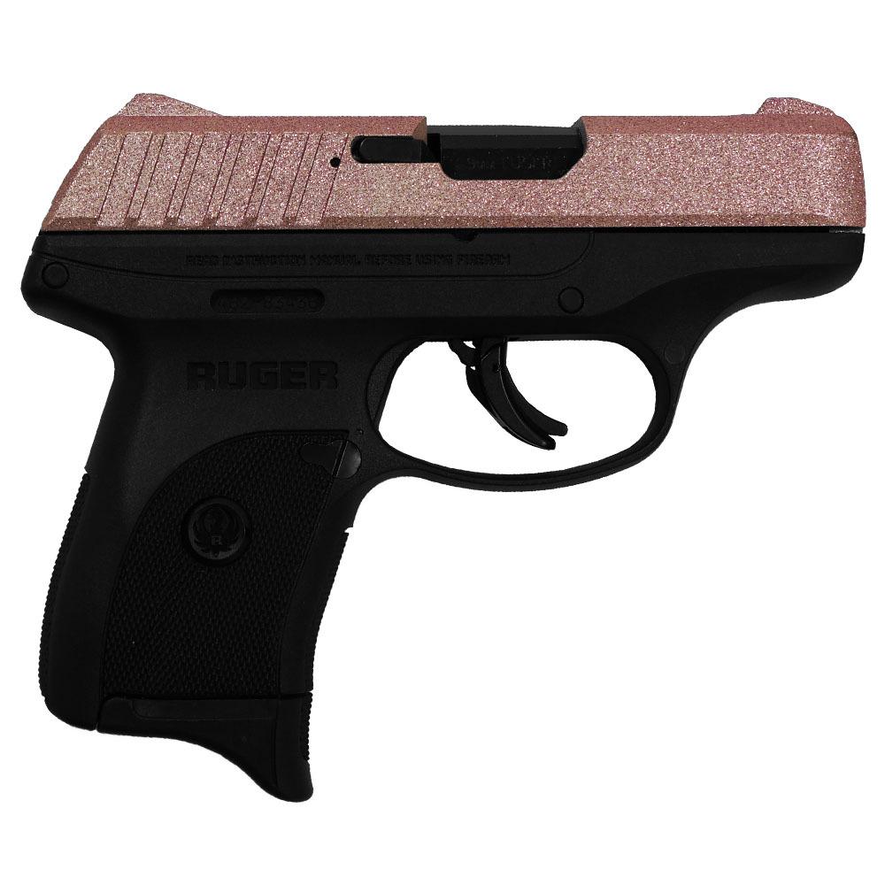 Pink Ruger handgun on white background.