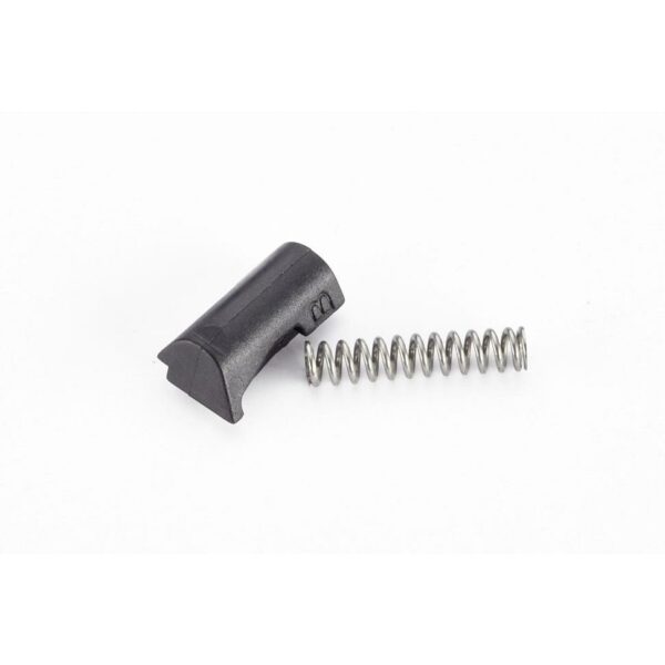 Black plastic part and metal coil spring