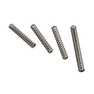 Four metal compression springs in different sizes.