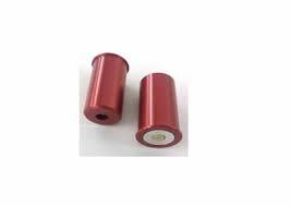 Two red cylindrical metal parts