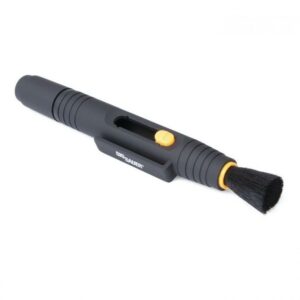Lens cleaning pen with retractable brush