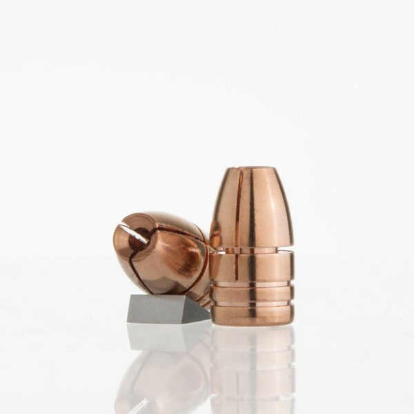 Copper bullet components on white background.