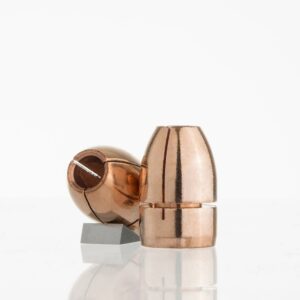 Copper jacketed hollow point bullet on white background.