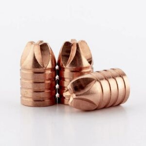 Three copper bullets on white background