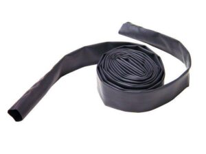 Rolled irrigation drip tape on white background.