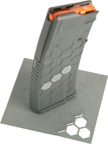 Hexagon-patterned magazine standing upright on a surface.