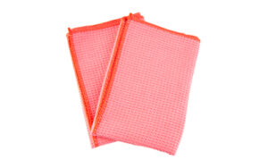 Red textured kitchen towels on white background