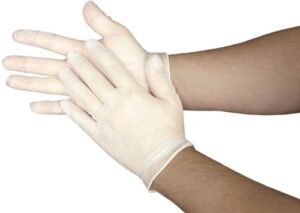 Person wearing latex gloves for safety and hygiene