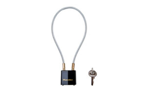 Cable lock with key on white background.