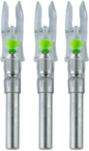Three medical needle safety devices with green indicators