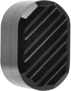 Metallic round object with grooved pattern detail.