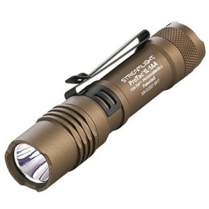 Compact tactical flashlight with clip and rugged design