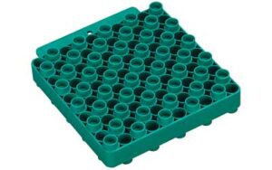 Green plastic tube rack with multiple holes.