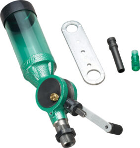Green powder measure with accessories for reloading.