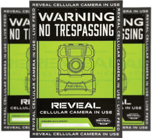 Warning sign with cellular camera in use.