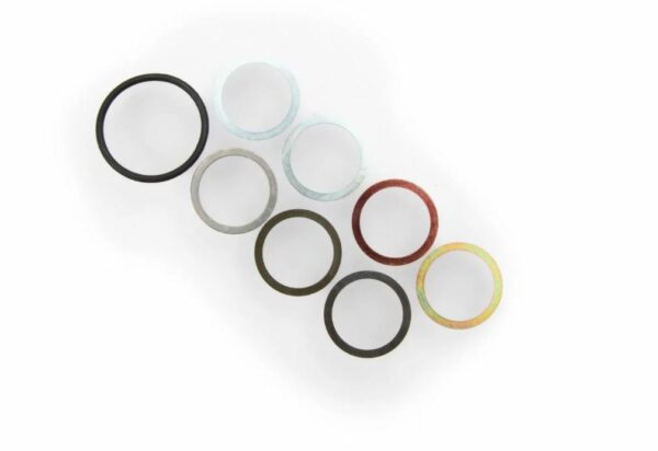 Assorted colorful metal rings on white background.