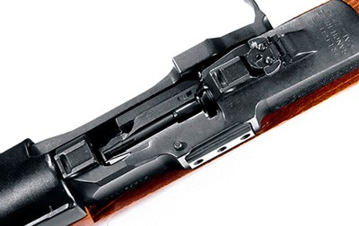 Close-up of a rifle mechanism, detailed view.