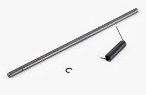 Metal rod and coil spring on white background.