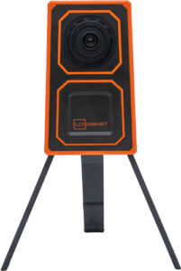 Portable orange and black outdoor camera with tripod.