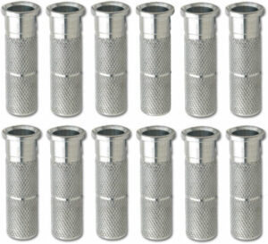 Twelve metal air hose couplings arranged in rows.