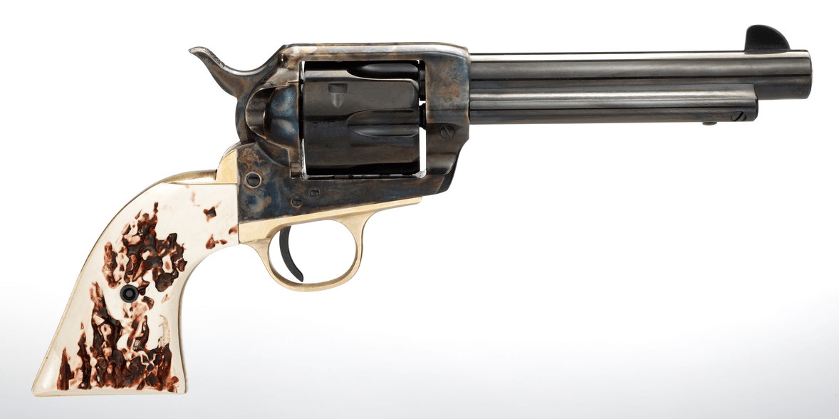 Vintage revolver with engraved handle and barrel.