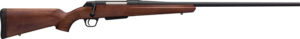 Bolt-action rifle with wooden stock and long barrel.