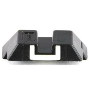Black plastic keycap, detached from keyboard.