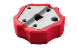 Red plastic wheel chock with anti-skid grooves