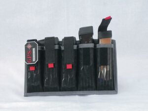 Black tactical magazine pouch with red accents.