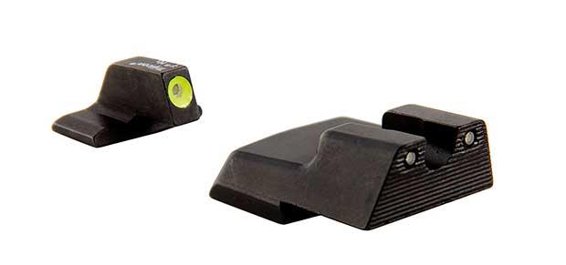 Black firearm night sights with luminous dots