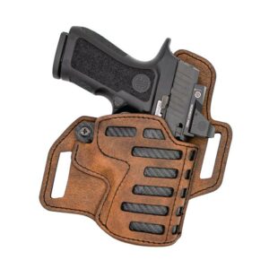 Black handgun in leather holster on white background.