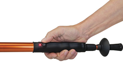Hand holding an electric telescopic tool handle.