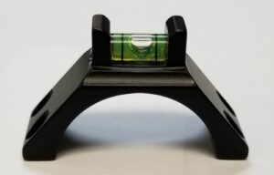 Black mounting bracket with built-in bubble level.